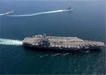 تنش دریایی اوج گرفت؛ شلیک ناو هواپیمابر آمریکا به پهپاد ایرانی / ایران پهپادی دیگر اعزام کرد/ عکس